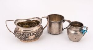 An English sterling silver sugar bowl, cream jug and mug, 19th and 20th century, (3 items), the sugar bowl 8cm high, 15cm wide, 330 grams total