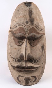 A gable mask, carved wood and shell with earth pigments, Papua New Guinea, ​​​​​​​63cm high