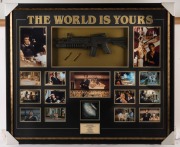 THE WORLD IS YOURS: A large and impressive "Scarface" movie presentation featuring a signed photograph of Al Pacino, 14 other photographic stills from the 1983 movie, a replica sub-machine gun with bullets, a pile of "white powder" and a rolled-up replica - 2