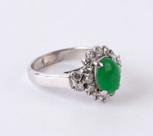 An 18ct white gold and jade ring set with 20 brilliant cut white diamonds, ​​​​​​​stamped "18K",