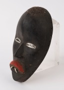 A tribal mask, carved wood, fabric and metal, African origin, 20th century, ​24cm high - 2