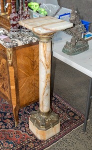 An antique turned onyx pedestal with ormolu mounts, 19th century, 108cm high, 30cm wide, 30cm deep