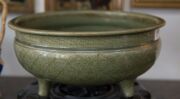 A large antique Chinese celadon porcelain censer with incised geometric design resting on three feet with a finely carved timber stand, Ming Dynasty 14th/15th century. 23cm high overall, 33.5cm diameter. PROVENANCE: Private Collection Melbourne with JOSHU - 2