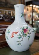 A Chinese spherical porcelain vase decorated with peaches, hibiscus and flying bats, 20th century, blue Qianlong mark, ​39cm high - 3