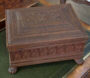 An Anglo-Indian workbox, superbly carved on all sides, with claw feet and compartmented lift out tray fitted with lids, early to mid 19th century, 18cm high, 32.5cm wide, 25.5cm deep - 3