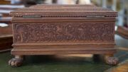 An Anglo-Indian workbox, superbly carved on all sides, with claw feet and compartmented lift out tray fitted with lids, early to mid 19th century, 18cm high, 32.5cm wide, 25.5cm deep - 6