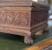 An Anglo-Indian workbox, superbly carved on all sides, with claw feet and compartmented lift out tray fitted with lids, early to mid 19th century, 18cm high, 32.5cm wide, 25.5cm deep - 7