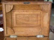 An Anglo-Indian workbox, superbly carved on all sides, with claw feet and compartmented lift out tray fitted with lids, early to mid 19th century, 18cm high, 32.5cm wide, 25.5cm deep - 8