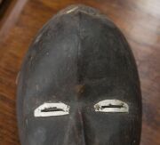 A tribal mask, carved wood, fabric and metal, African origin, 20th century, ​24cm high - 4