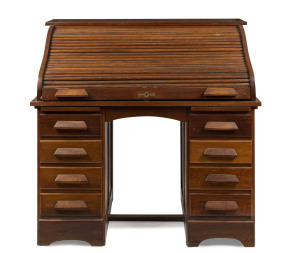 An Australian blackwood roll-top desk in the Cutler style, early 20th century, ​117cm high, 122cm wide, 75cm deep
