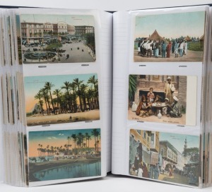 POSTCARDS - EGYPT: single volume collection of mostly older (1900s-1940s) coloured cards mostly from larger settlements including Alexandria, Cairo, Heliopolis, Port Said, Port Tawfiq, Suez and Thebes, with lots of town views, native scenes, animated street scenes, port/river views, pyramids, etc. (300)
