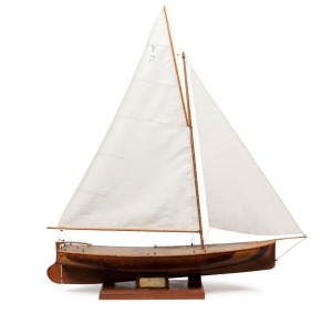 A scratch built model yacht made from Tasmanian timbers, freshly rigged, 19th/20th century, 83cm high, the hull 62cm long