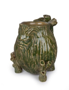 WILLIAM RICKETTS pottery face jug with branch handle and feet, incised decoration with rare and early green glaze, incised "W. M. Ricketts, 1934", 8cm high, 8cm wide