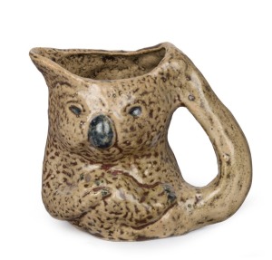 STAN & GEOFF GILBERT (MERRIC BOYD design) koala jug with grey glaze, signed "Koala, VIC, Aust., 1929", 11cm high, 12cm wide