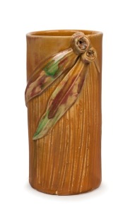 REMUED cylindrical pottery vase with applied gumnuts and leaves, unusual incised decoration with brown and pink glaze, incised "Remued", 17cm high