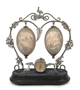 Australiana silver plated mantel clock with two carved emu eggs depicting a kangaroo, cockatoo, kookaburra and lyrebird in bush settings, late 19th century, 36cm high