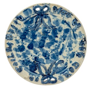 ALFRED CORNWALL circular pottery bread plate with mottled blue and white glaze, 19th century, rare, incised "J. TOOMEY, UNION STREET, WEST BRUNSWICK", ​​​​​​​29.5cm diameter