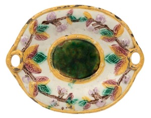 A Colonial Australian pottery bread platter with bramble motif, 19th century, 30cm wide