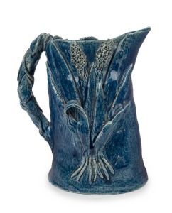 ARTIST UNKNOWN hand-built blue glazed pottery jug with applied rose and wheat decoration, incised signature to base (illegible), 18cm high