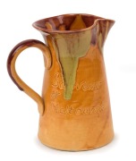 PAMELA "Batman, Souvenir of Melbourne" pottery profile portrait jug with unusual caramel glaze with pink and green highlights, incised "Pamela, 1934", ​​​​​​​14cm high - 2