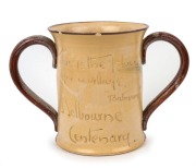 REMUED&nbsp;"Batman, Melbourne Centenary"&nbsp;rare pottery two-handled cup with applied figure in landscape, incised "This Is The Place For A Village", signed "Remued", 15cm high, 22cm wide - 2