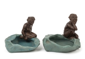 WILLIAM RICKETTS pair of unusual pottery dishes with kneeling Aboriginal figures, rare blue and brown colourway, the female example incised "W. M. Ricketts, Melbourne, 1935", 8cm high, 10cm wide