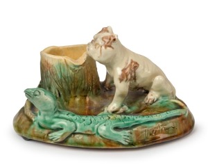 An unusual pottery stump vase with applied bulldog and lizard, incised "Victoria" on the side, most likely Sydney origin, incised signature to base (illegible), 9.5cm high, 18cm wide