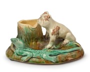 An unusual pottery stump vase with applied bulldog and lizard, incised "Victoria" on the side, most likely Sydney origin, incised signature to base (illegible), 9.5cm high, 18cm wide