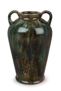 "DISABLED SOLDIER'S POTTERY" vase with two handles and green glaze, Monogram cross mark to base, 21cm high