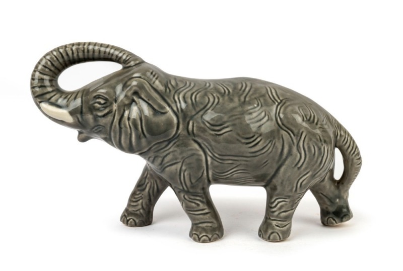 BENDIGO POTTERY Elephant statue with raised trunk, 18cm high, 32cm long