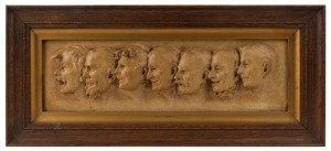 ARTIST UNKNOWN, ​​​​​​​Seven profile portraits, patinated plaster panel, early 20th century, 14 x 47cm, 27 x 60cm overall