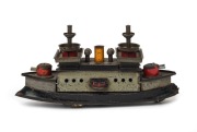 HESS (Germany): wind-up tinplate dreadnought battleship, with key; in working order, ship moves forward bobbing up & down when mechanism is activated; length 21cm, height 11cm, c. mid-1920s. 