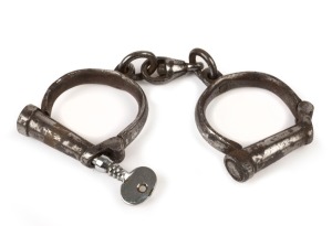 SM & Co. WW1 period antique standard size handcuffs with key, early 20th century, stamped "SM & Co., 1917, M&C, 56" with broad arrow mark, size 2 and numbered 280, 23cm wide