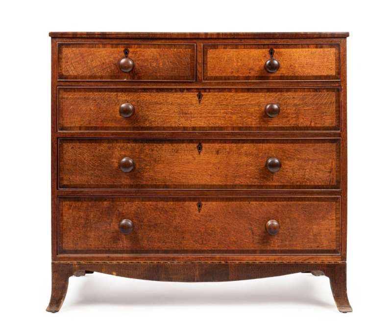 An antique English oak chest of five drawers with mahogany cross-banding, circa 1800, 99cm high, 107cm wide, 55cm deep