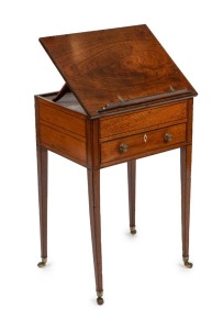 A Sheraton reading table, mahogany with ebony string inlay and bone escutcheon Finely crafted with tilting lid and original brass handles and castors, fitted accessory drawer to the right hand side, late 18th century. A rare and exceptional example. 74cm high, 48cm wide, 37cm deep