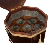 A Georgian brass bound mahogany cellarette of octagonal form with tapering square form legs and brass castors, original zinc lined interior with bottle bezel, circa 1800 65cm high, 46cm wide, 46cm deep - 2