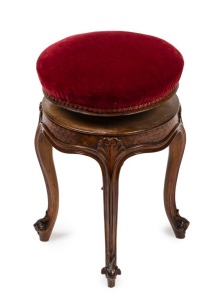 A French carved walnut adjustable piano seat with red velvet circular top, 19th century, 50cm high, 34cm diameter