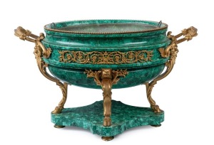 A superb antique French wine cooler, carved malachite with ornate ormolu mounts, adorned with face masks and hoof supports, original tin liner and attractive scrolling pierced and fretted foliate mounts to sides. Most likely made for the Russian market, mid 19th century, an impressive 39cm high, 67cm wide, 36cm deep