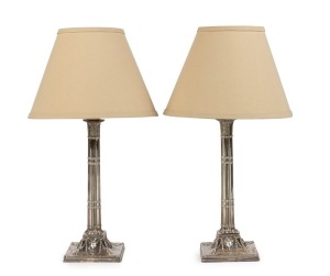 A pair of sterling silver candlesticks converted to electric table lamps with shades, 19th and 20th century, 60cm high overall