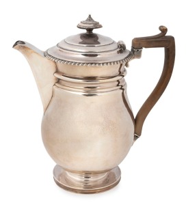 A Georgian sterling silver baluster shaped coffee pot of impressive proportions. Circular platform base with a large ovoid baluster form bowl and pointed sparrow beak spout. Made by Thomas Robins of London, circa 1815, 24cm high, 792 grams total