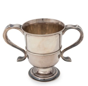 A George II English sterling silver loving cup. Circular moulded foot base with an attractive, slightly tapered cylindrical bowl and single raised reeded band to the centre part. Two hollow tapering loop handles, one to either side, and an attractive splay top rim. Made by John Langlands of Newcastle, circa 1757, 16cm high, 526 grams