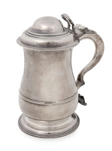 George II English sterling silver covered tankard with circular moulded foot base to a well proportioned body having single reeded rim raised to the lower part. An attractive loop handle with heart shaped terminal to base. Original hinge with looped thumb