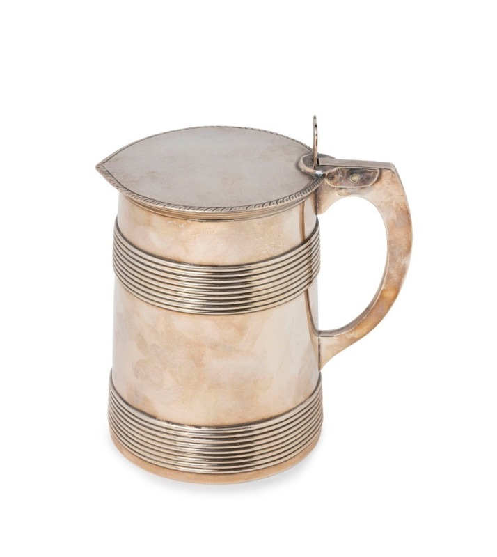 GEORGE III English sterling silver straight sided ale mug with two bands of raised reeding to the sides, hollow 4-sided simple loop handle with hinged cover adorned with gadrooning to the edge. By  Sebastian I & James Crespell of London, circa 1767, 14cm
