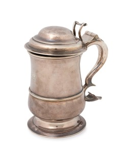George II English sterling silver lidded baluster shaped tankard with circular raised foot, single band of raised reeding to the lower body, a hinged and domed lid with open-cast thumbpiece. Note the very attractive engraved elephant armorial crest. made 