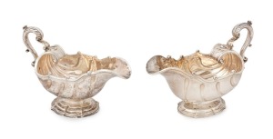GEORGE III fine quality pair of cast sterling silver Rococo style sauce boats with scallop-footed bases, generous shell-shaped bodies and double scroll handles. Made by Richard Sibley of London, circa 1824 & 1825, 14.5cm high, 21.5cm wide, 1170 grams total