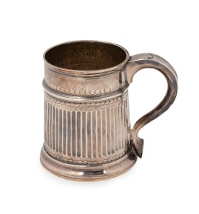 A fine Britannia standard silver ale mug with circular moulded foot, vertical fluted decoration to the body and decorative leaf and scroll decoration to the rim. Loop handle and sole-shaped palm rest, stamped "FA" in round cartouche, London, circa 1710, 10.5cm high, 252 grams.