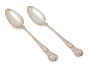 An antique English pair of "Coburg" pattern sterling silver stuffing spoons; each with hallmarks to the underside of the bowl together with scallop-shell decoration. Stamped "W.R.S.", made in London, circa 1857, 30cm long, 422 grams total