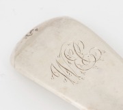 A Georgian sterling silver "Fiddle" pattern basting spoon with engraved initials "W.E.C." to the handle. By Charles Boyton of London, circa 1829, 29.5cm high, 110 grams. - 2