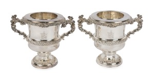 A very fine pair of Old Sheffield Plate wine coolers of classical design with original fitted liners and removable rims. Adorned with engraved armorial crests with exceptional quality cast handles and applied rococo band decoration, circa 1810. 25cm high