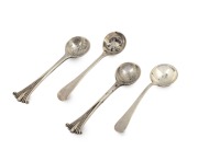 A fine quality set of four sterling silver table salts; each of circular form with repoussé decoration standing on circular feet. Accompanied by four assorted sterling silver salt spoons. Late 19th century, 150 grams total - 2